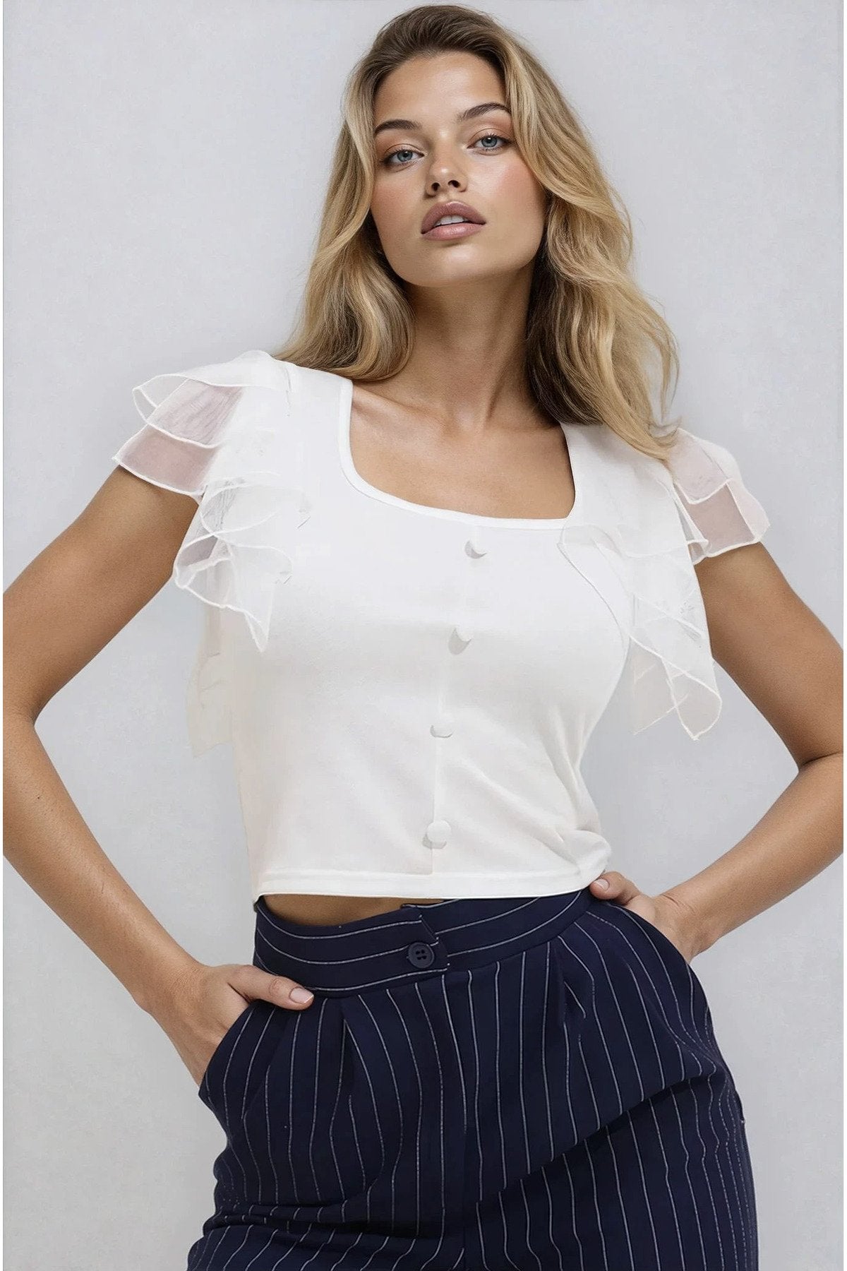 KADIN DÜĞME DETAYLI KOLU TÜLLÜ ESNEK ÖRME KUMAŞ BLUZ