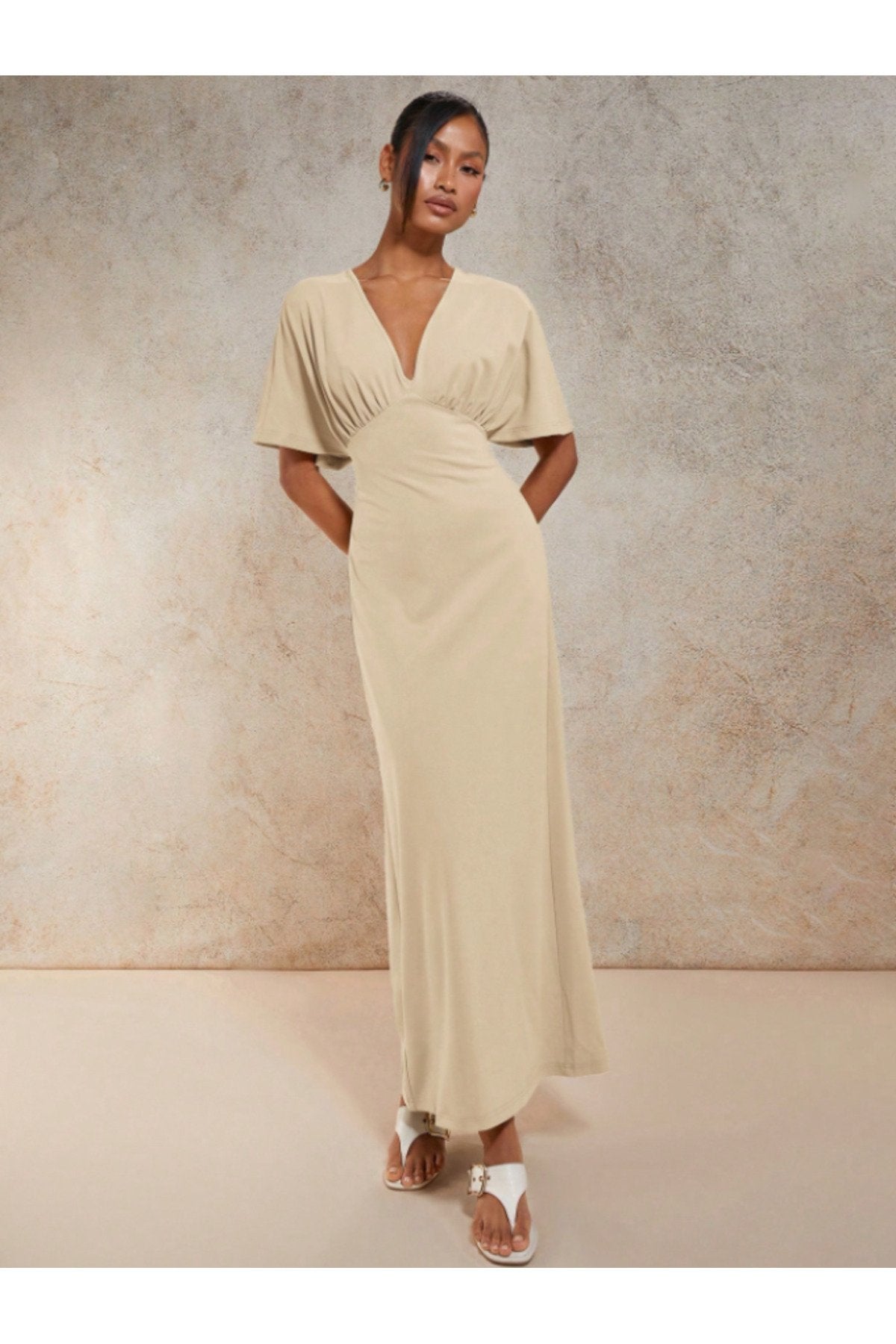 KADIN V YAKA MELEK KOL GÖĞSÜ BÜZGÜ DETAYLI ESNEK ÖRME KUMAŞ UZUN BOY ELBİSE